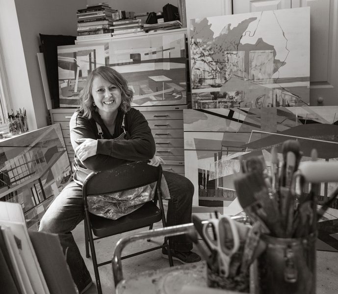 black and white portrait of Utah artist Linnie Brown in her studio